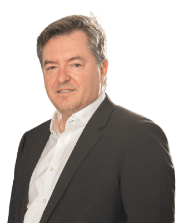 Professional headshot of Sylvain Côté wearing a dark blazer and white shirt against a plain background.